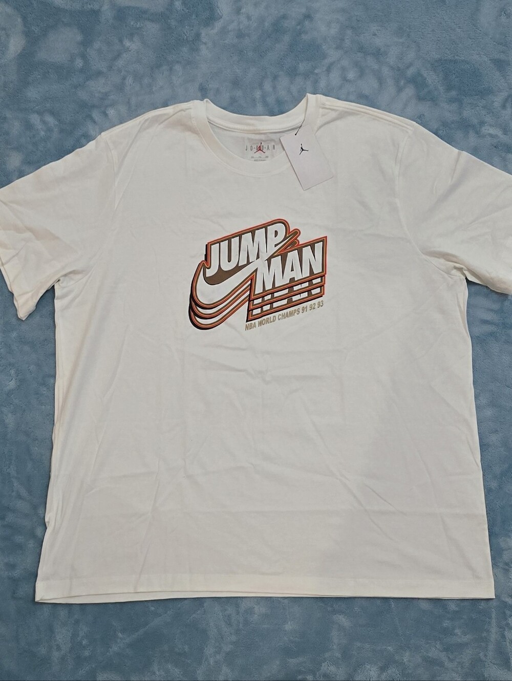 Jordan White Short-Sleeve Tee with Orange and Brown Jumpman Graphic